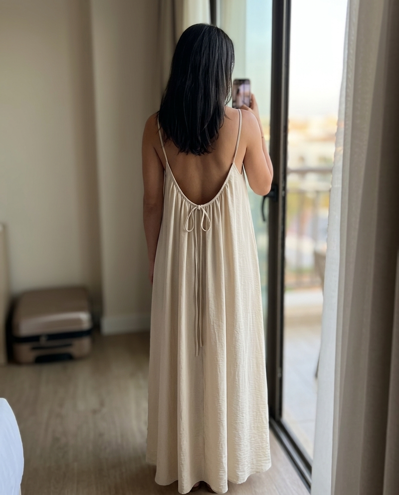 Customer wearing the backless dress at home