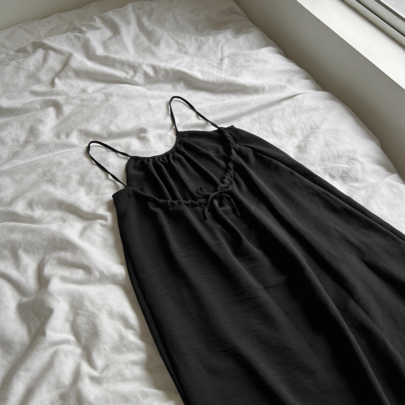 Customer wearing the backless dress at home
